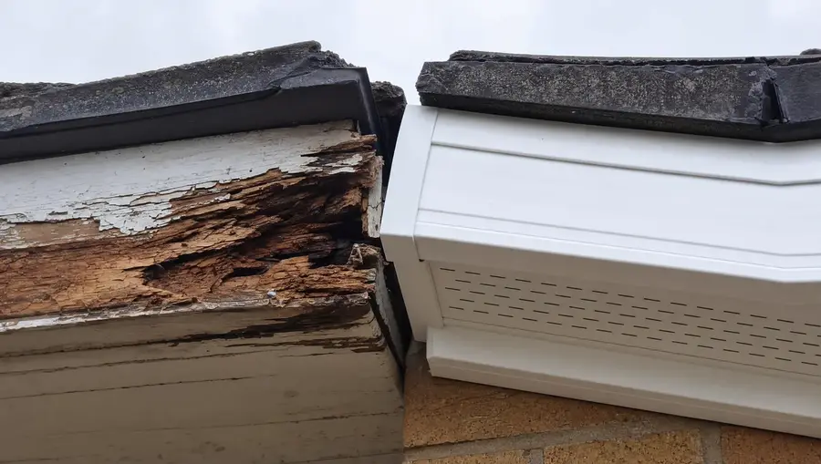 Rotten timber fascia next to new white uPVC fascia with vented soffit