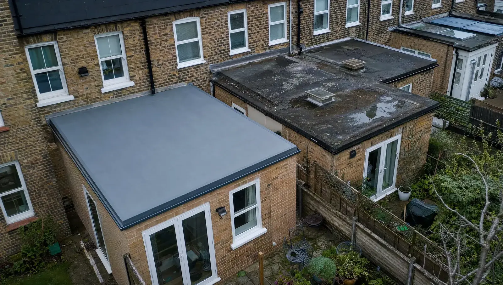 Aerial view of UK extension flat roofs in varying conditions, one newly replaced and one aged