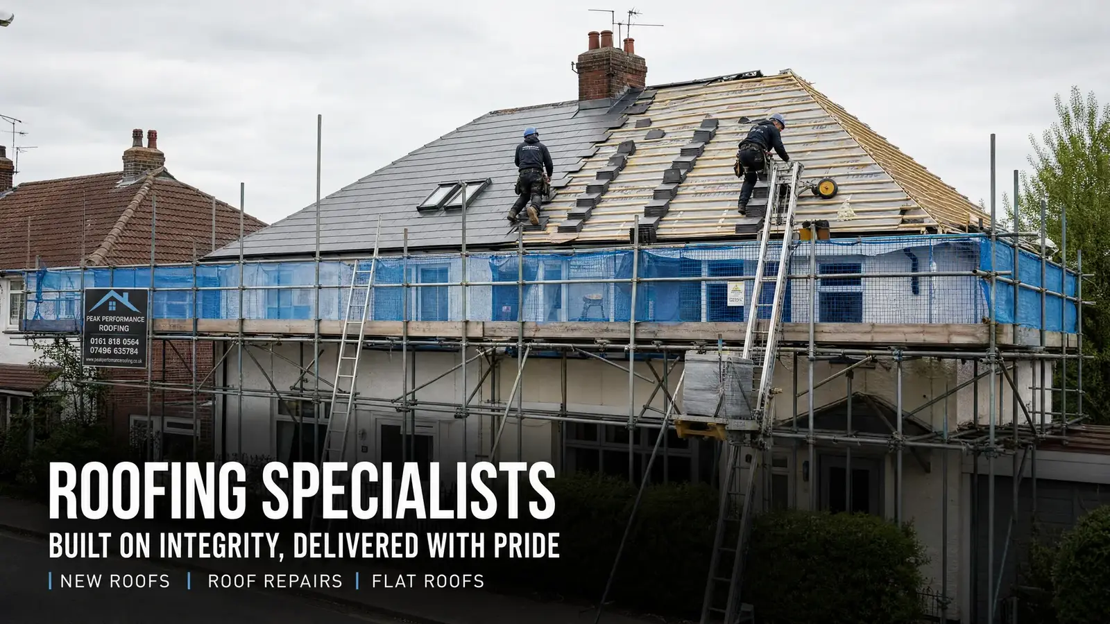 Roofers repairing a slate roof on a UK semi-detached house