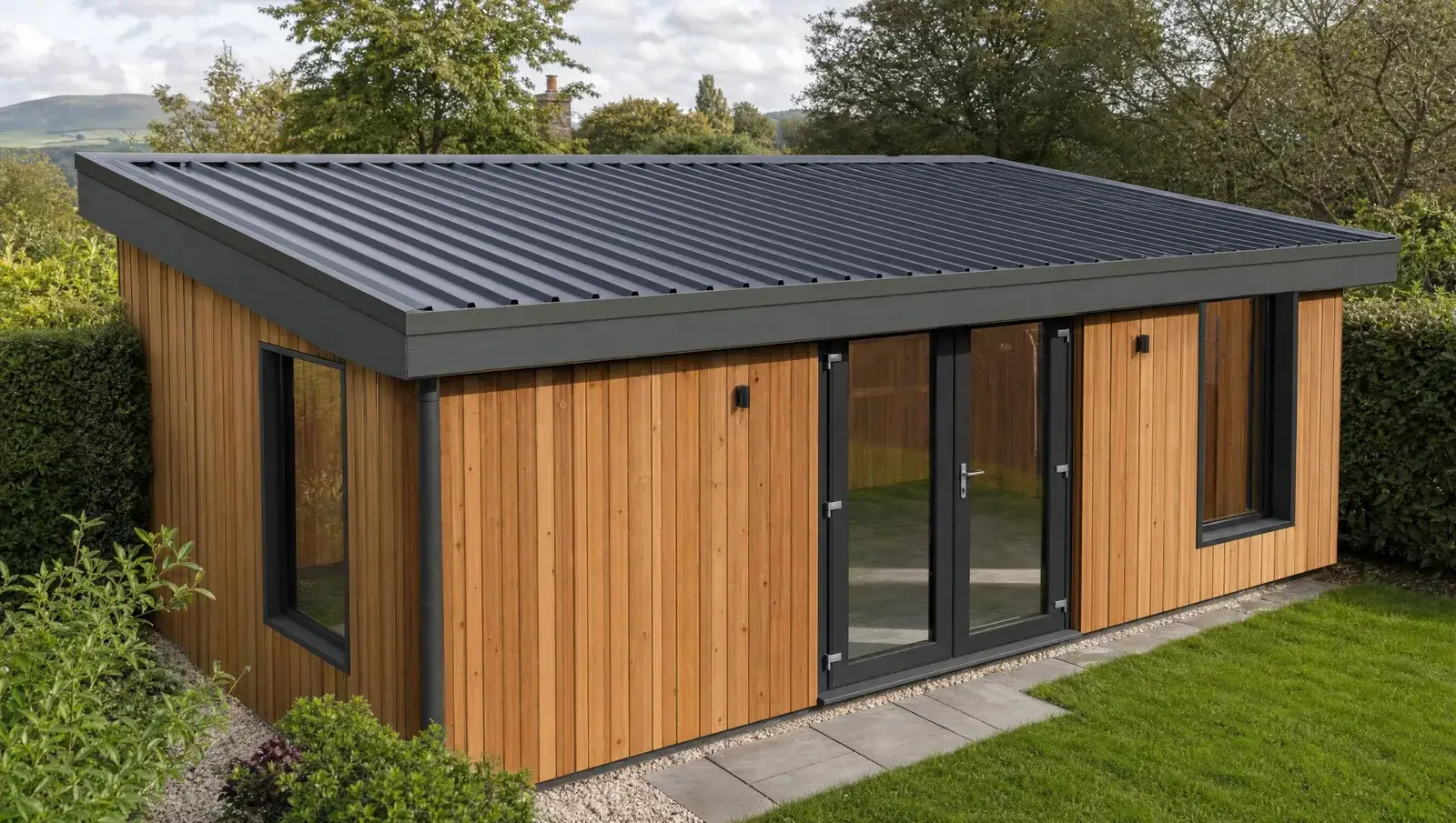Anthracite box-profile steel roof on a timber garden workshop