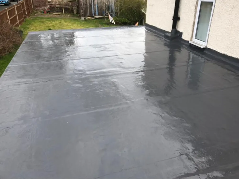 Seamless grey flat roof over a rear extension