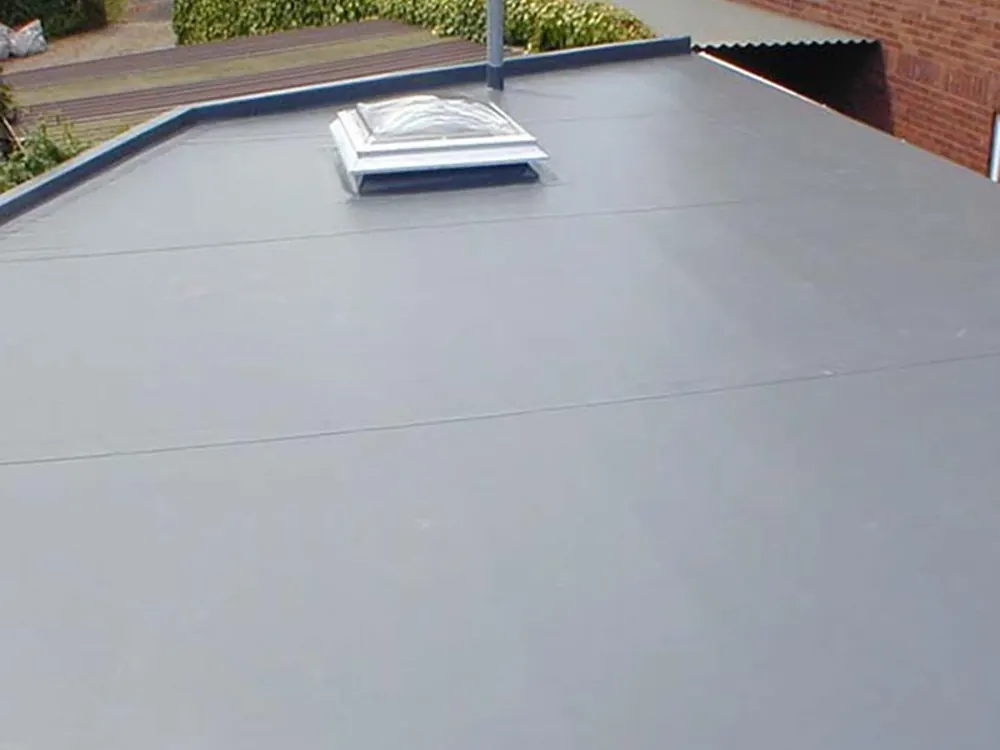 New grey flat roof with a rooflight dome