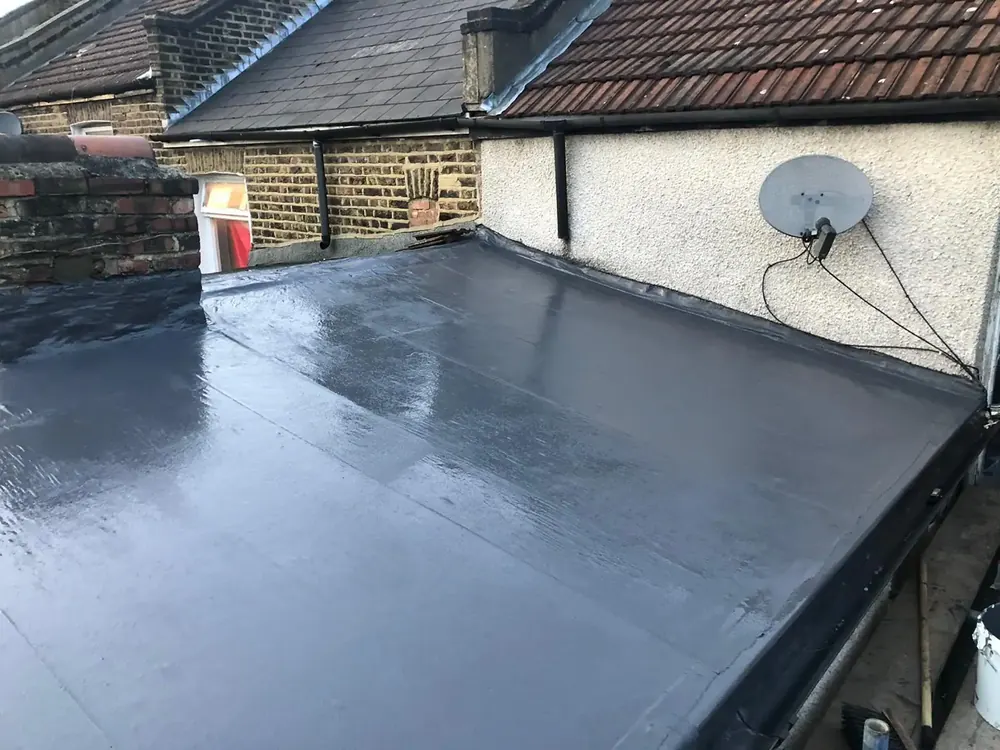New grey fibreglass flat roof on a rear extension