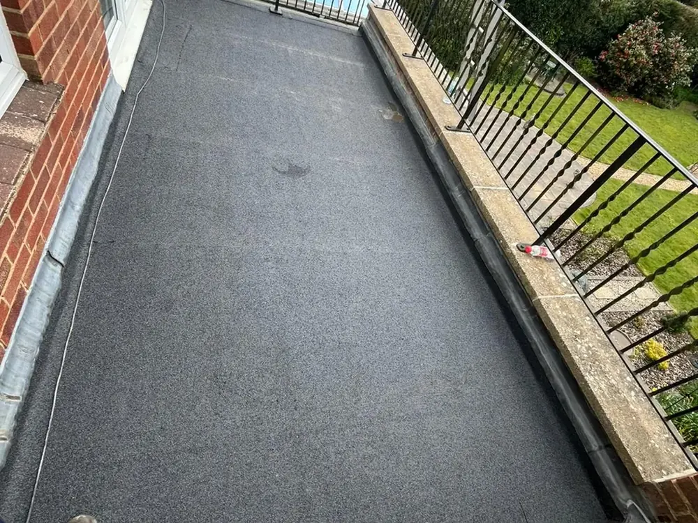 Finished torch-on felt flat roof on a balcony in East Grinstead