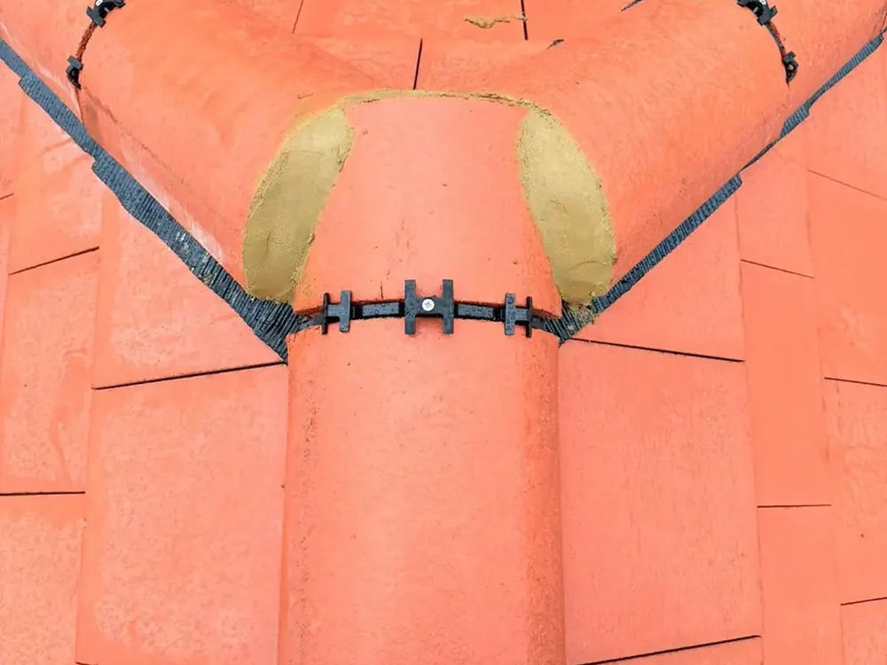 Dry ridge unions fixed along a new red tile ridge
