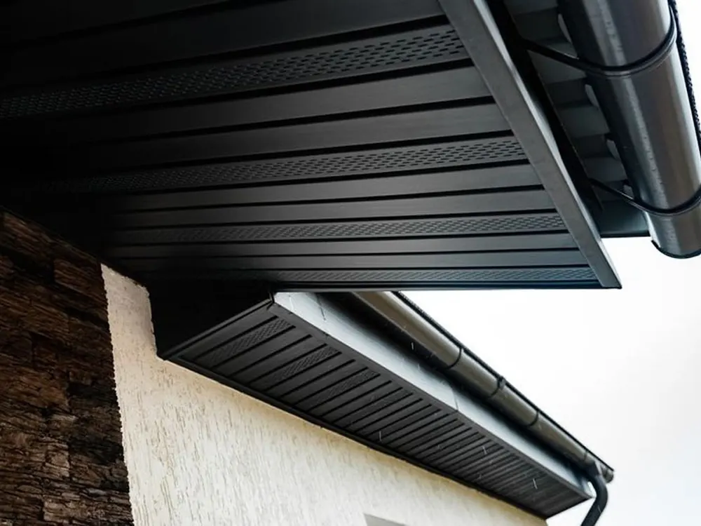 New black uPVC fascia, vented soffit and gutter on a roofline