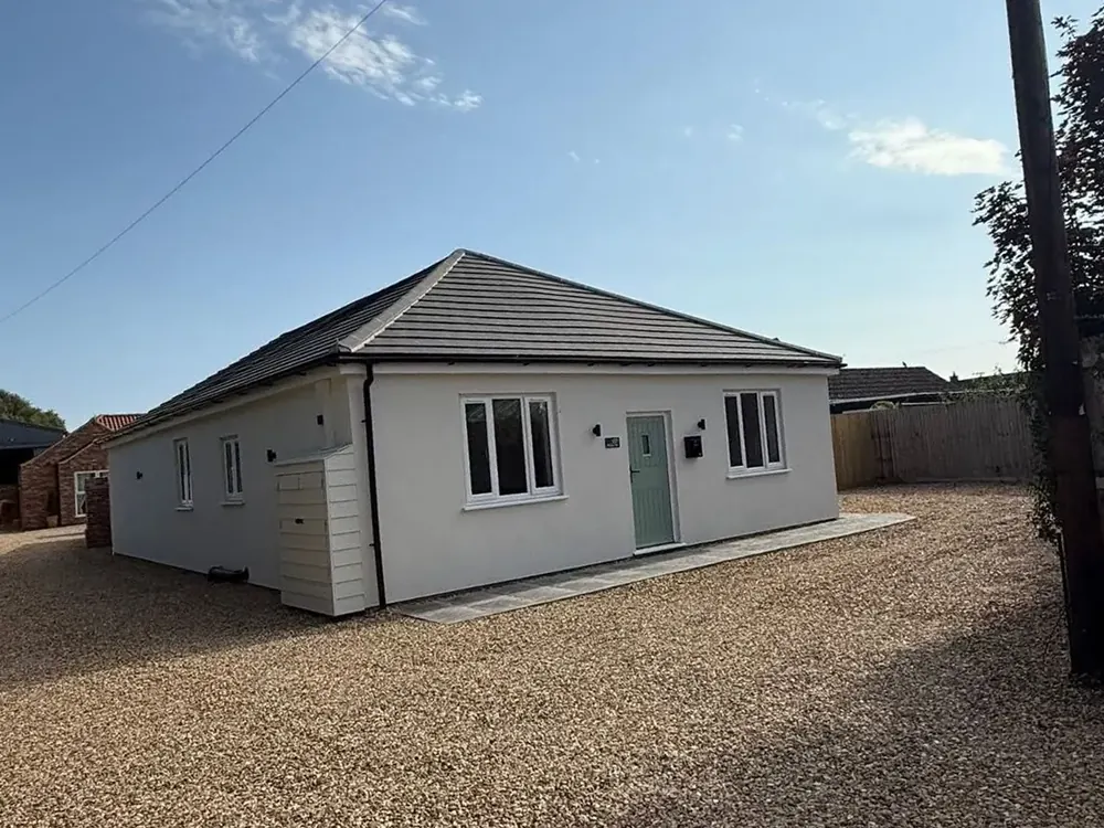 White bungalow in Leverington with its new grey tiled roof after renovation