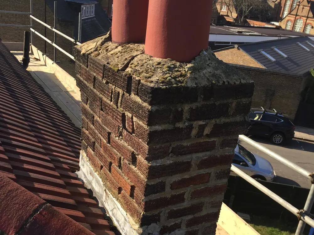 Chimney rebuilt in new brick with pots and flaunching