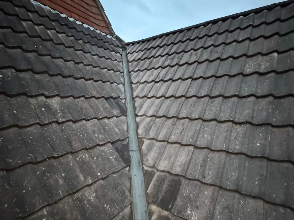 Lead valley running down between two interlocking tile slopes