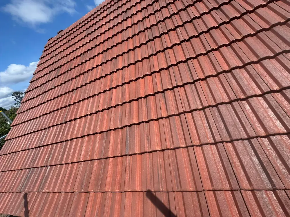 Red clay tile roof laid on a new roof in Farnborough