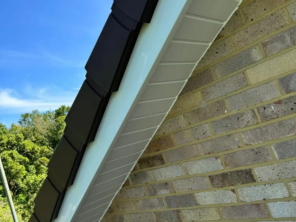 White uPVC fascia and soffit with a dry verge along the gable