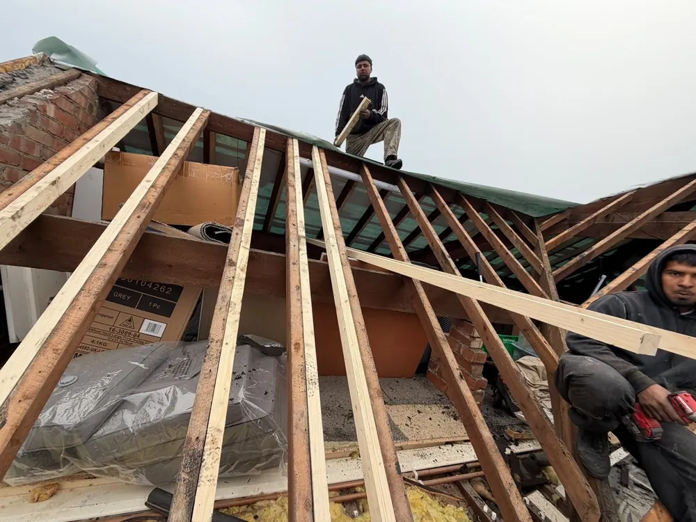 Roof stripped back to the rafters with the team at work