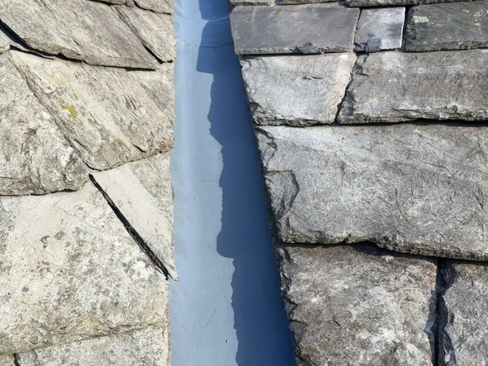 New rubber-coated valley on a slate roof