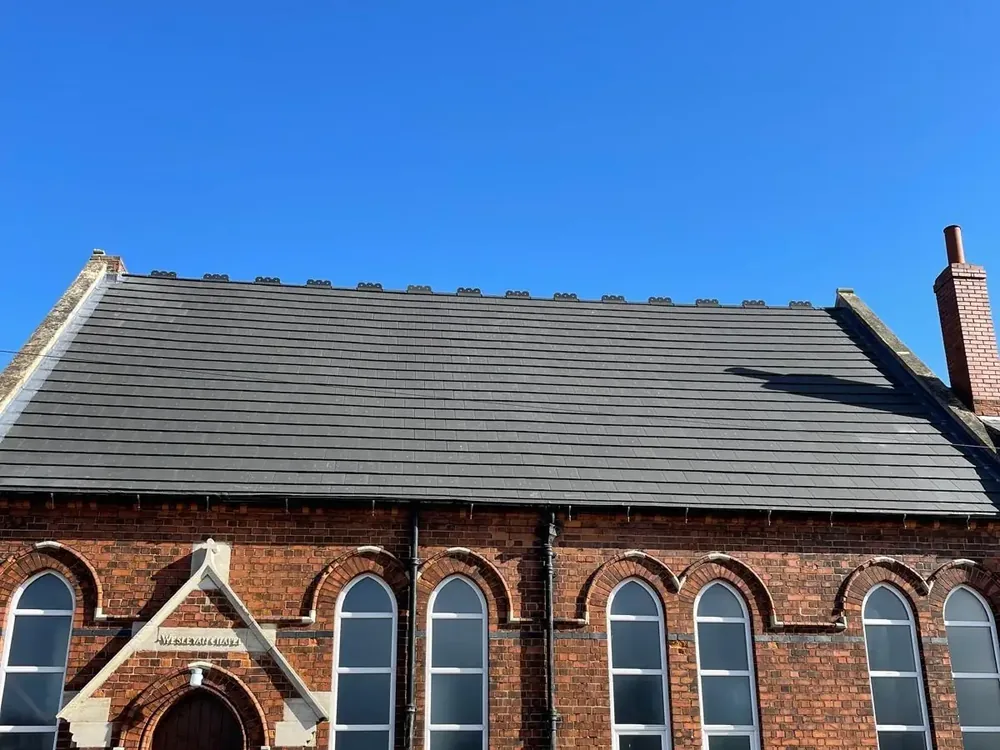 Re-roofed Victorian chapel in red brick with a new grey tiled roof