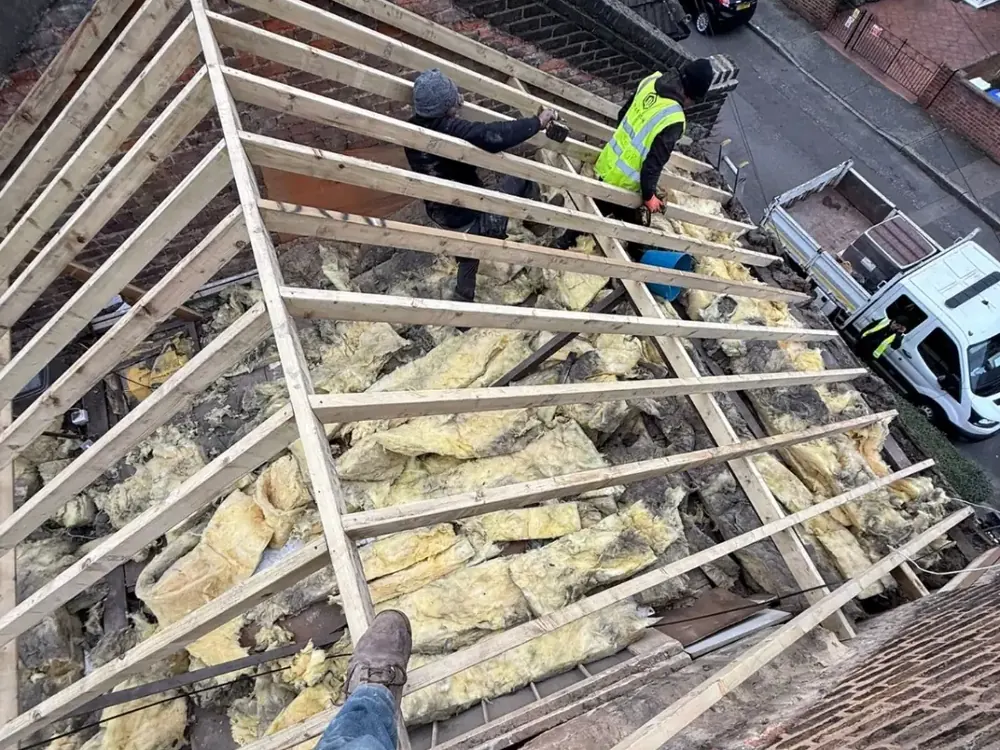 Roof stripped back to the rafters with loft insulation showing