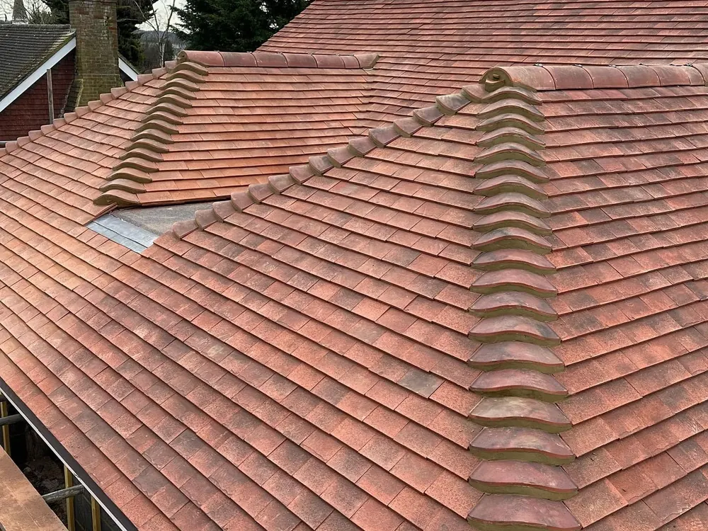 Finished red plain tile hip roof