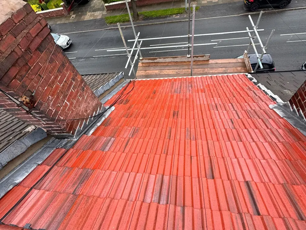 Red tile roof from the ridge with the street below