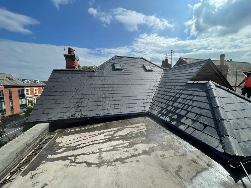 New slate-effect roof rising above a flat roof on a Sussex terrace