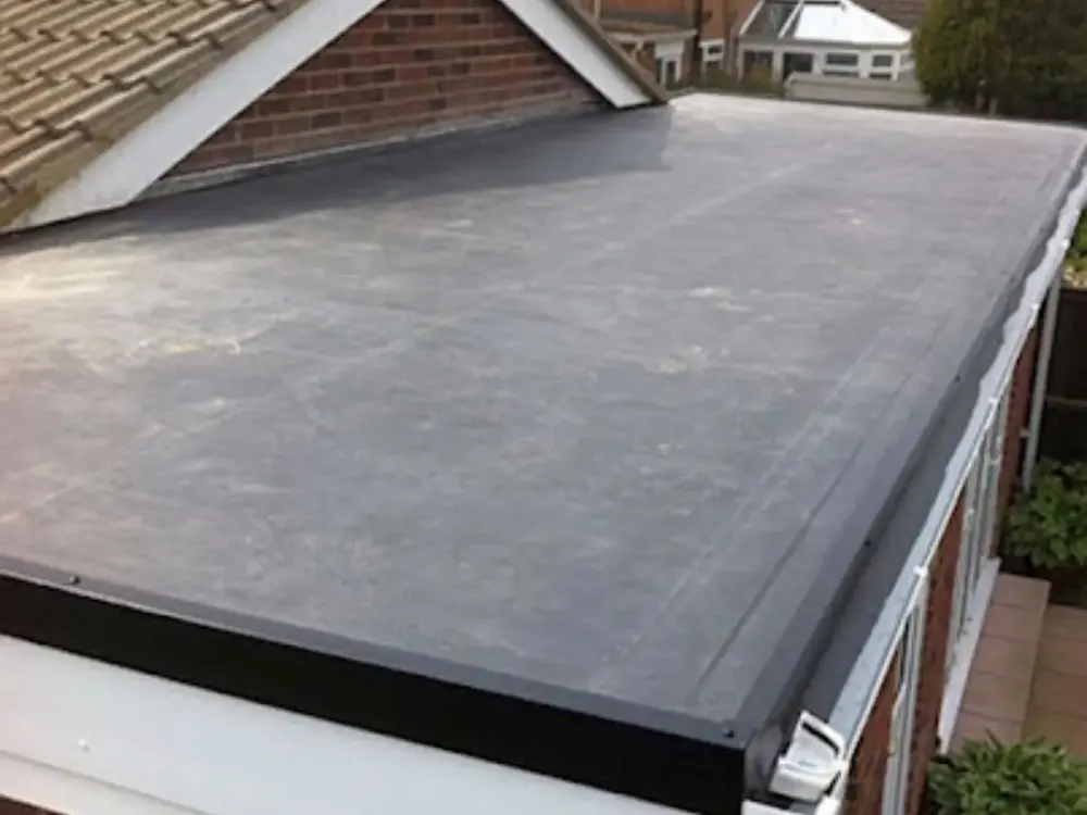 New grey felt flat roof on a single-storey extension