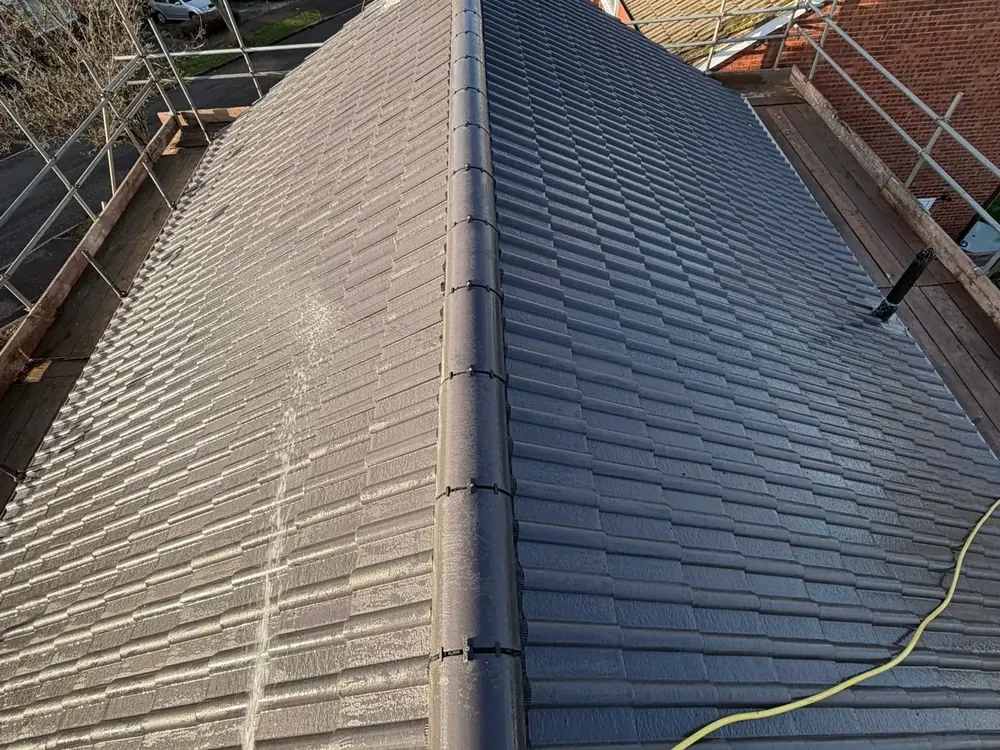 Long run of new dry ridge along a freshly tiled roof